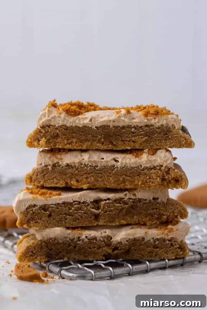 Crumbl Cookie Butter Cookie Crunch Ice Cream 12 Stack of Crumbl cookie butter ice cream cookies, showing the layers of cookies and creamy frosting