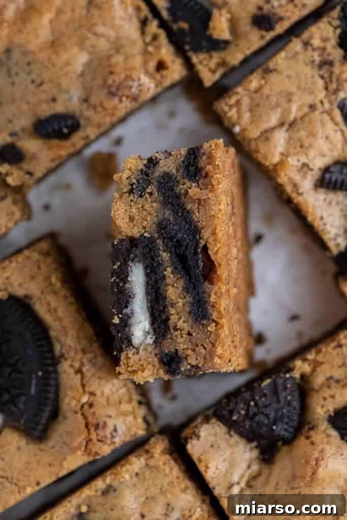 Decadent Oreo Blondie Delights 10 Overhead shot of freshly baked Oreo blondies sliced into squares in the pan