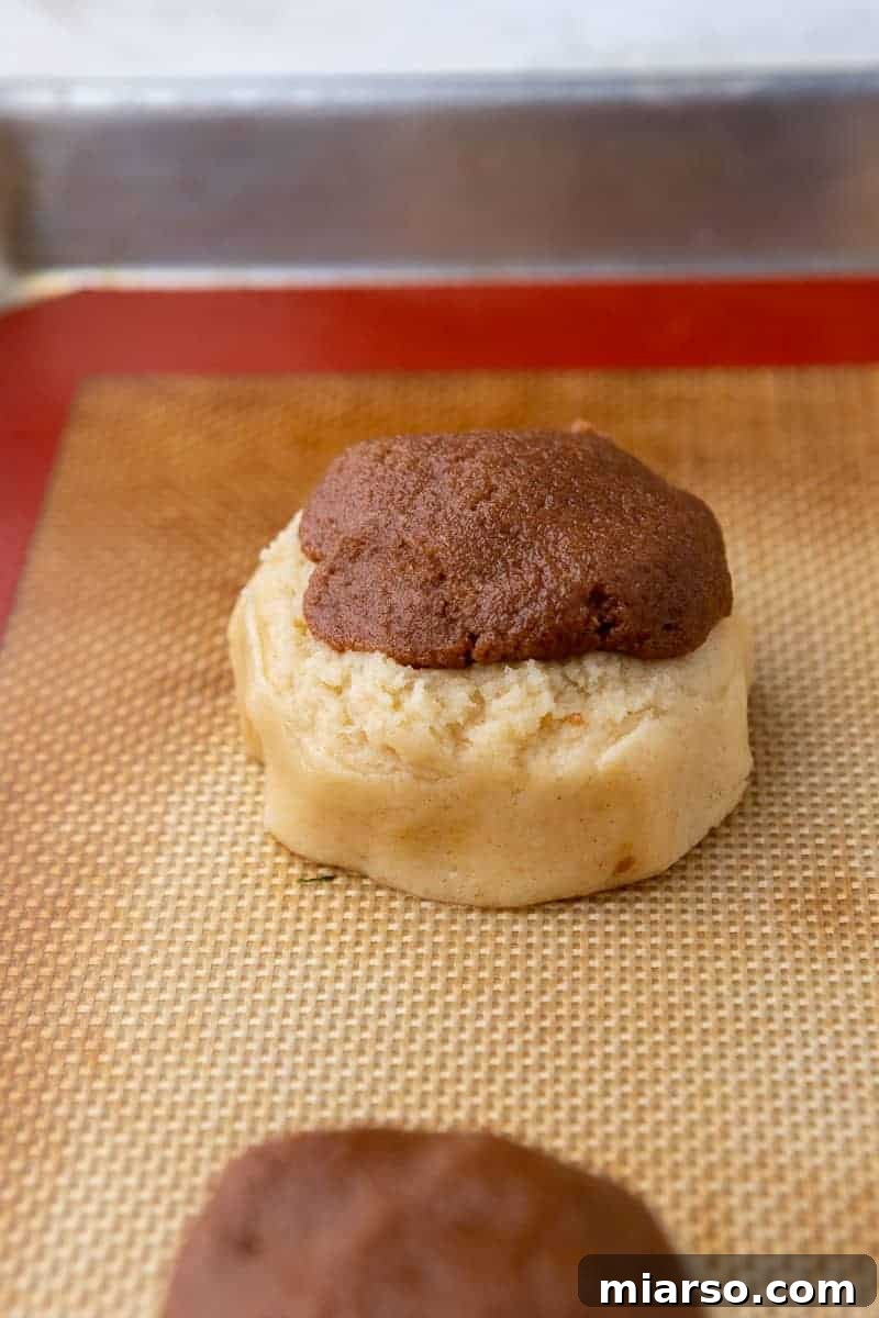 Cinnamon roll cookie dough on baking sheet before chilling