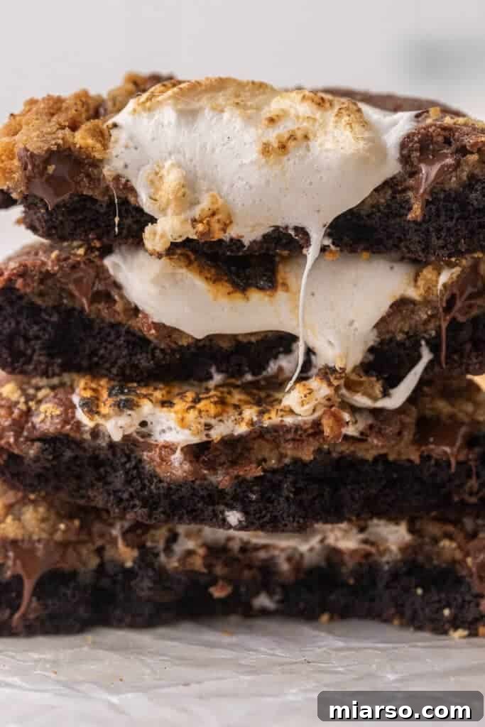 Close up of S'mores brownie cookies cut in half, showing layers