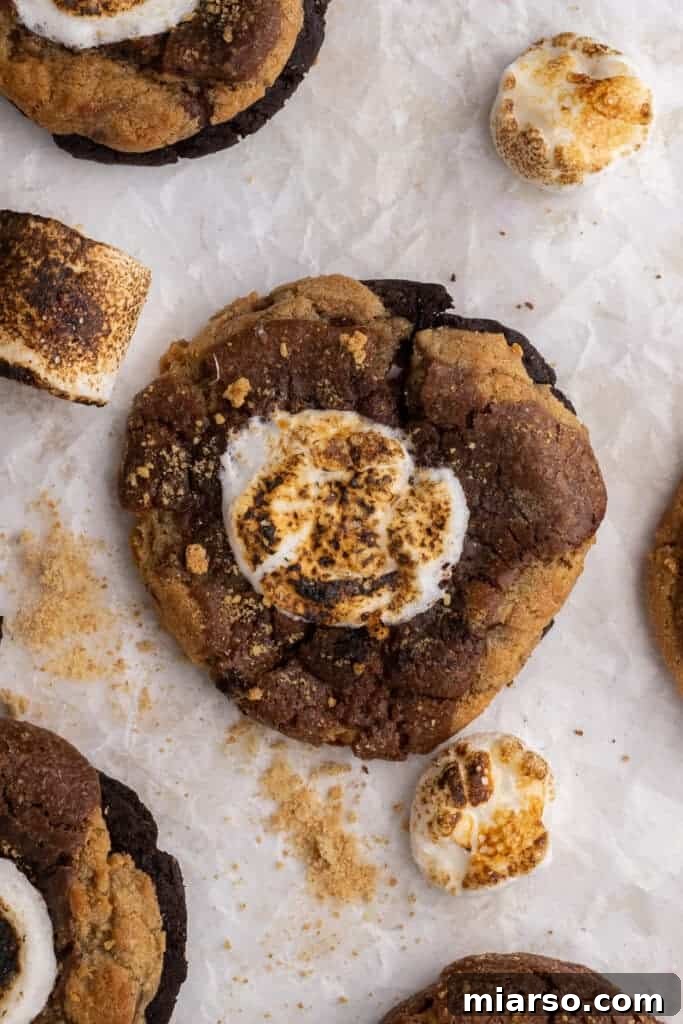 Mini Crumbl S'mores brownie cookies on a cooling rack