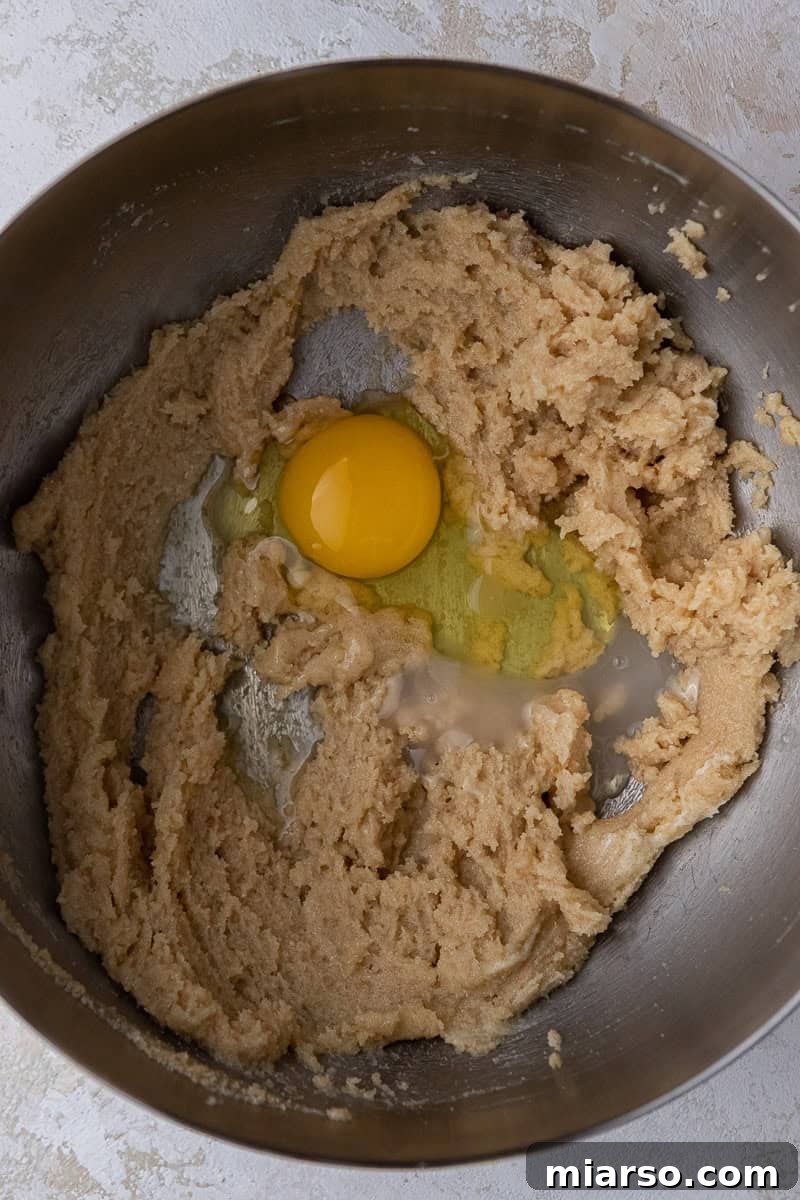 Eggs and creamed butter in mixing bowl 