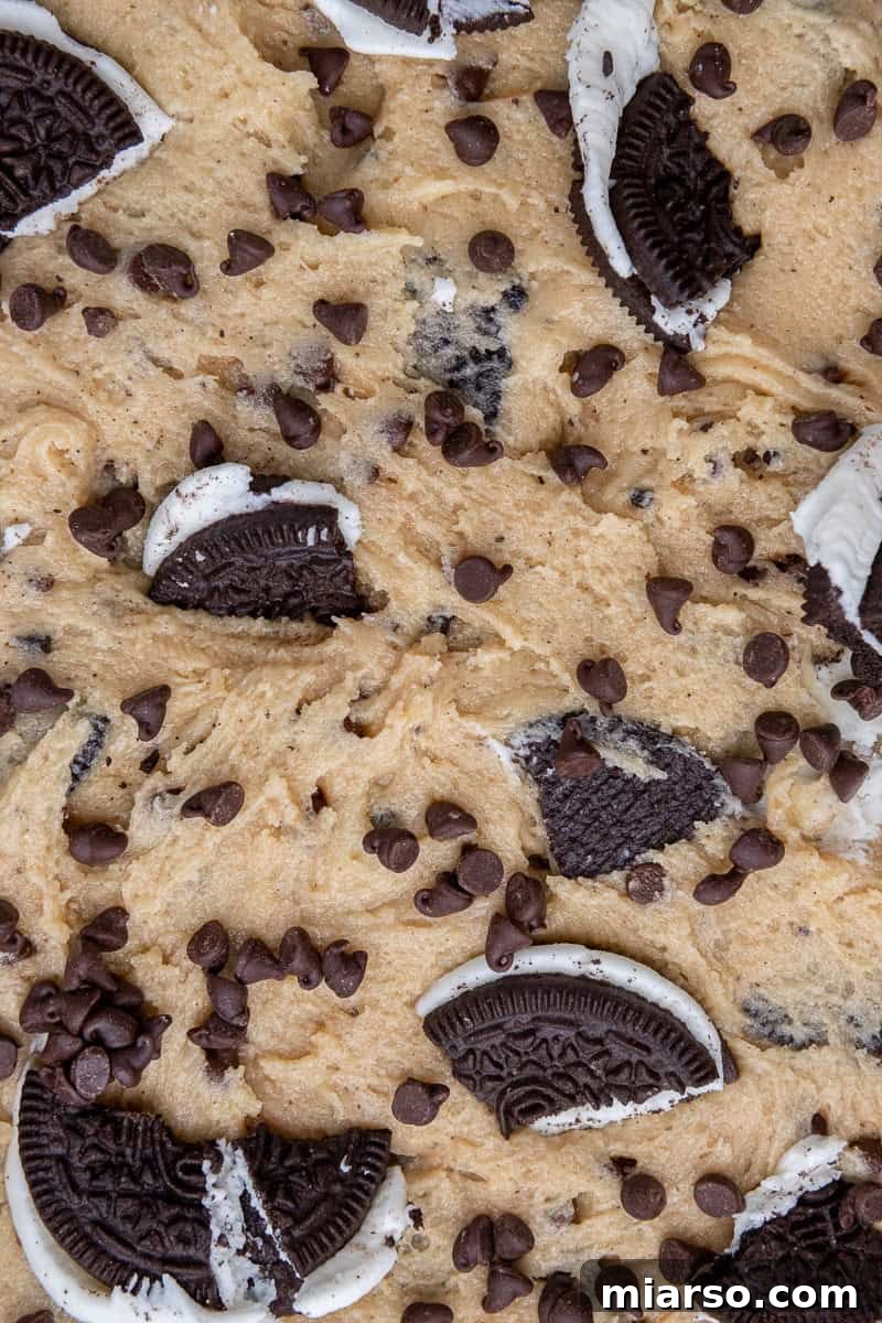 Effortless Giant Oreo Skillet Cookie 7 Another close-up shot of the cookie dough pressed into the skillet, showing the generous amount of Oreos and chocolate chips.
