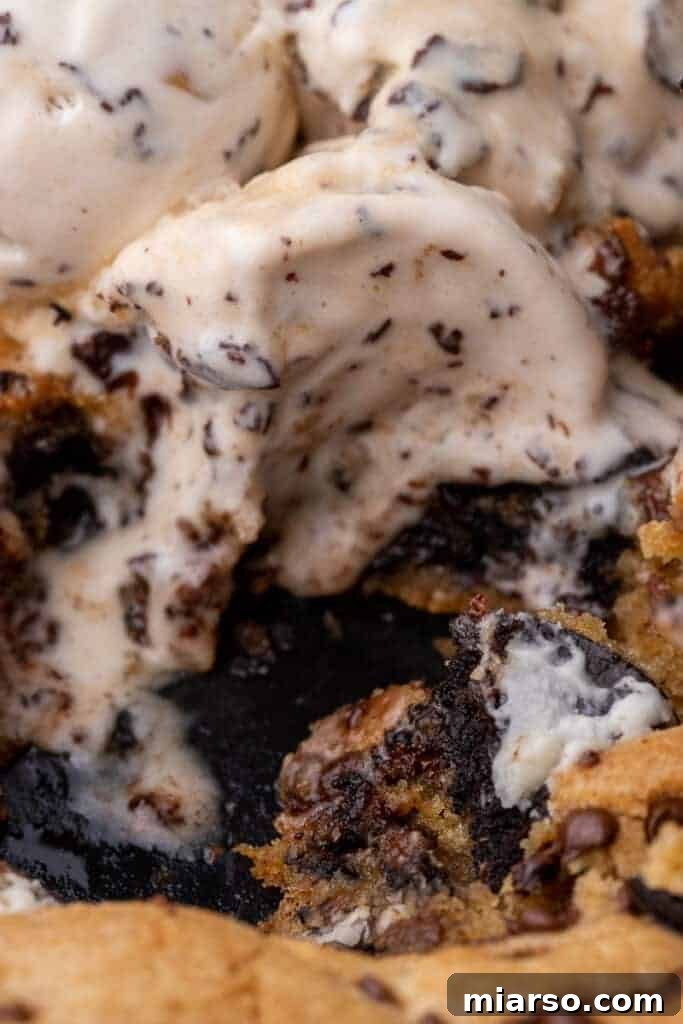 Effortless Giant Oreo Skillet Cookie 9 A close-up shot of the finished cookies and cream skillet dessert, showing its rich texture and toppings.