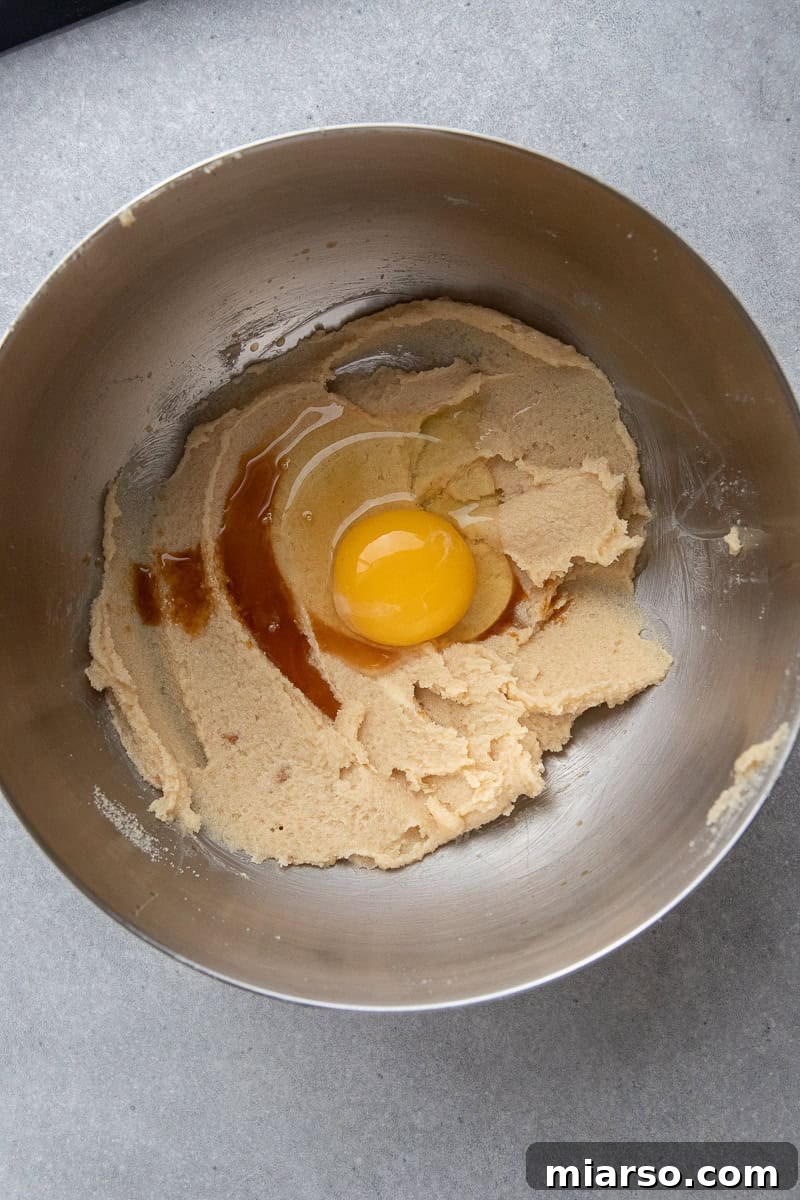 Ultimate Oreo Chocolate Chip Cookies 5 Creamed butter and egg in a bowl