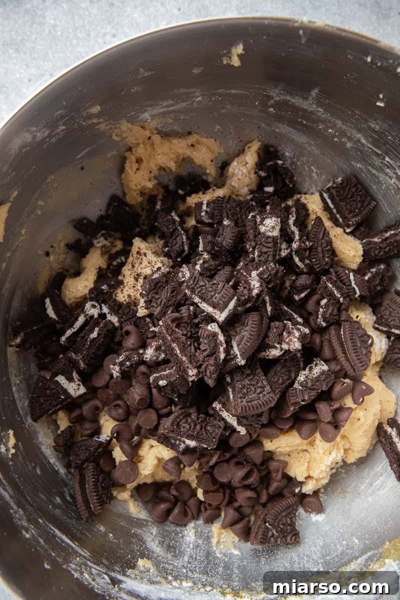 Ultimate Oreo Chocolate Chip Cookies 6 Oreos in cookie dough in bowl