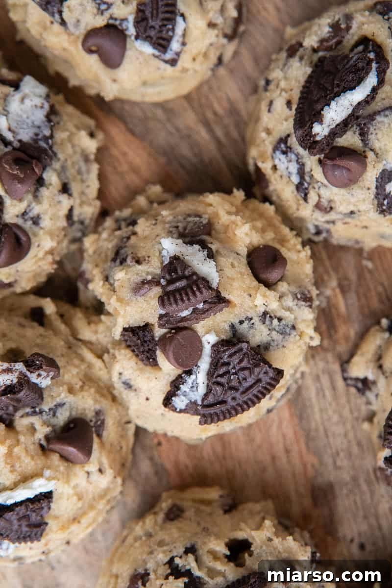 Ultimate Oreo Chocolate Chip Cookies 8 Scooped cookie dough on wooden board