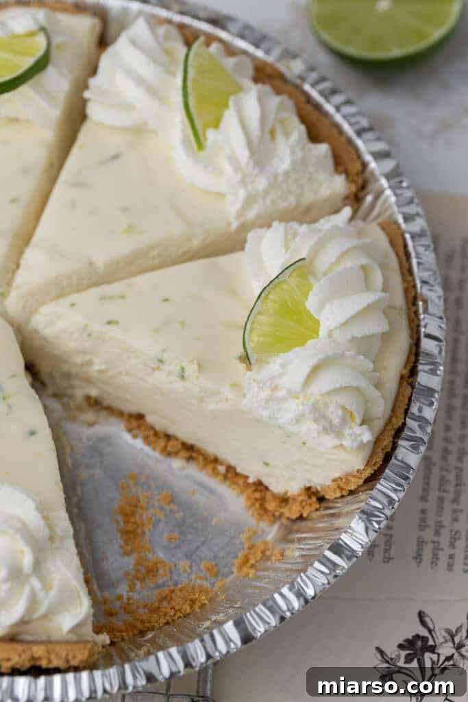 Slice of no bake key lime pie in a pie plate