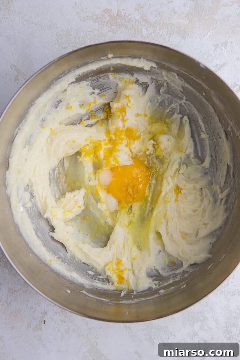 Creamed butter and sugar in a bowl, showing a light and fluffy texture