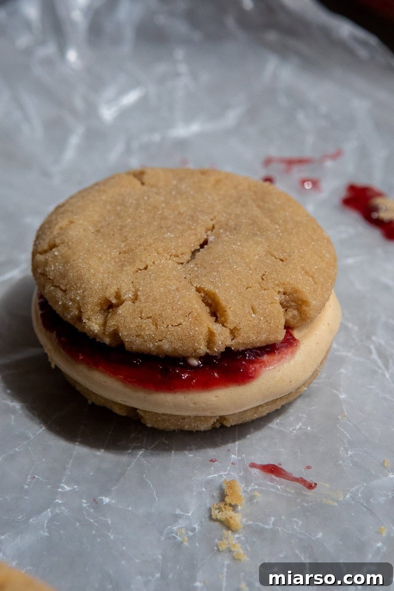 Ultimate Peanut Butter and Jelly Cookie Sandwich 12 Crumbl peanut butter and jelly sandwich cookies
