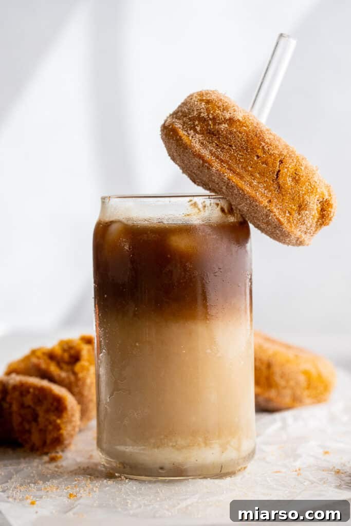 Decadent Pumpkin Spice Donut Perfection 4 Pumpkin donut served with a macchiato latte