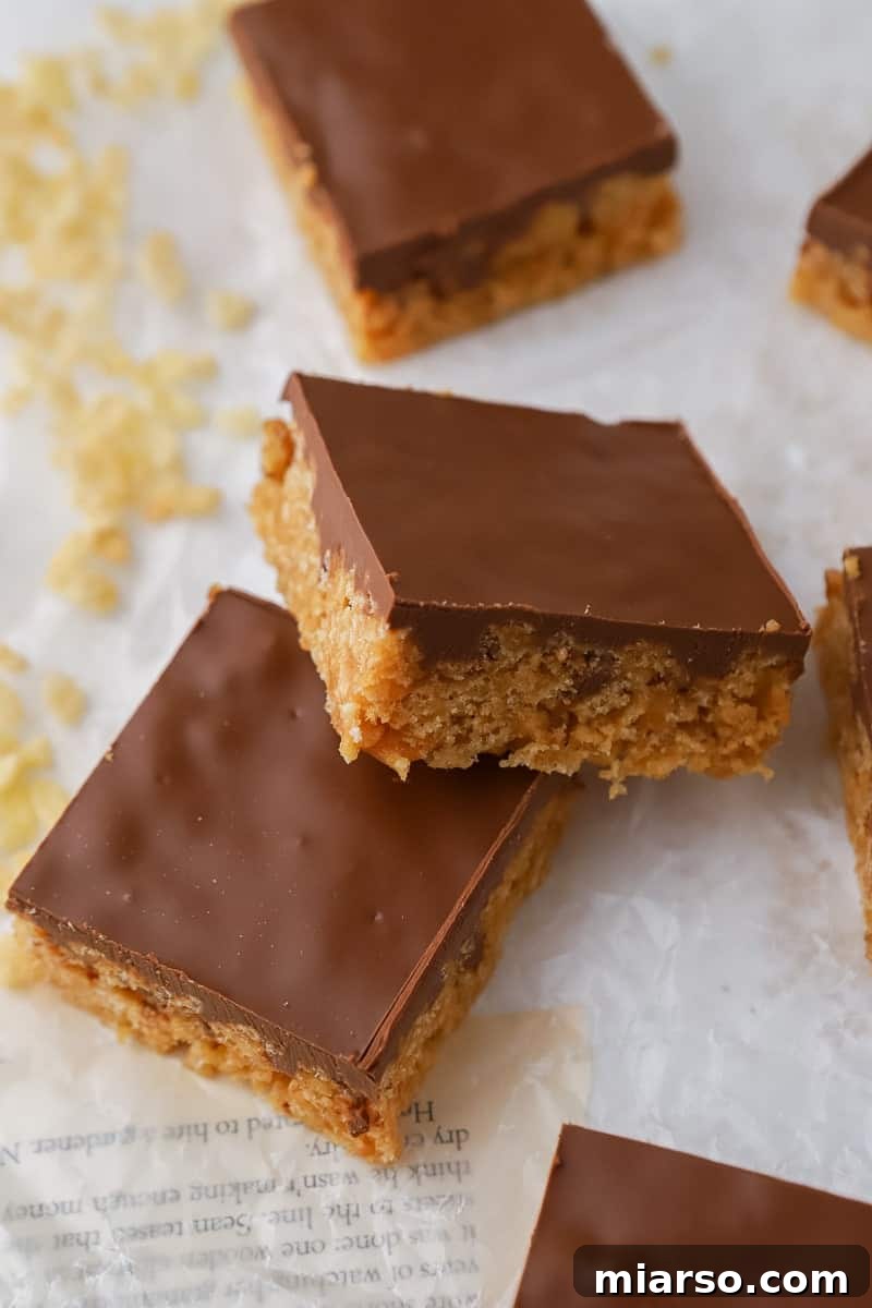Sliced Scotcheroos bars, showcasing the distinct layers of crispy base and chocolate topping.