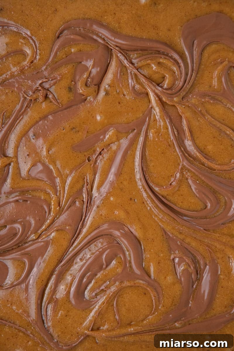 Decadent Nutella Swirl Blondies 8 Beautiful Nutella swirls created in the blondie batter before baking