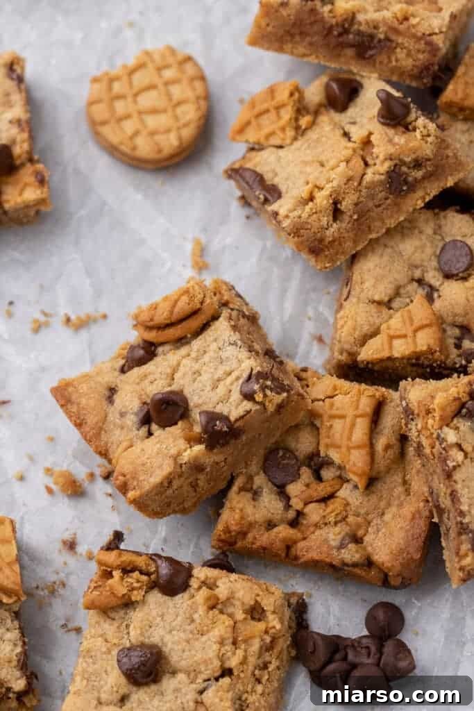 A batch of freshly baked Nutter Butter chocolate chip bars, cooling in a baking pan.