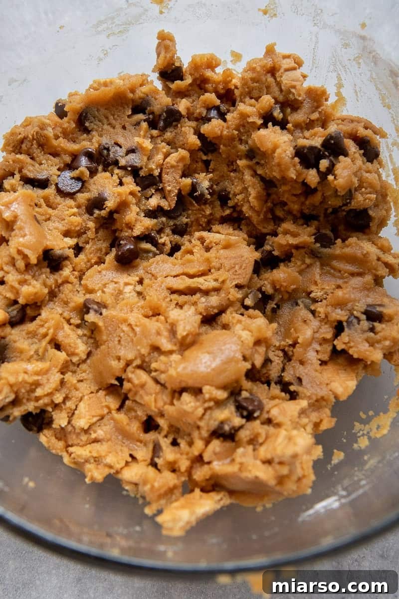 Close-up of thick, rich cookie dough ready for baking.
