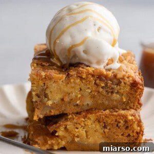 Stack of pumpkin dump cake with ice cream on top