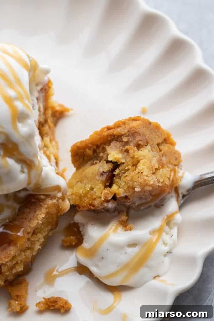 Close-up of a delicious bite of pumpkin crunch cake showing layers