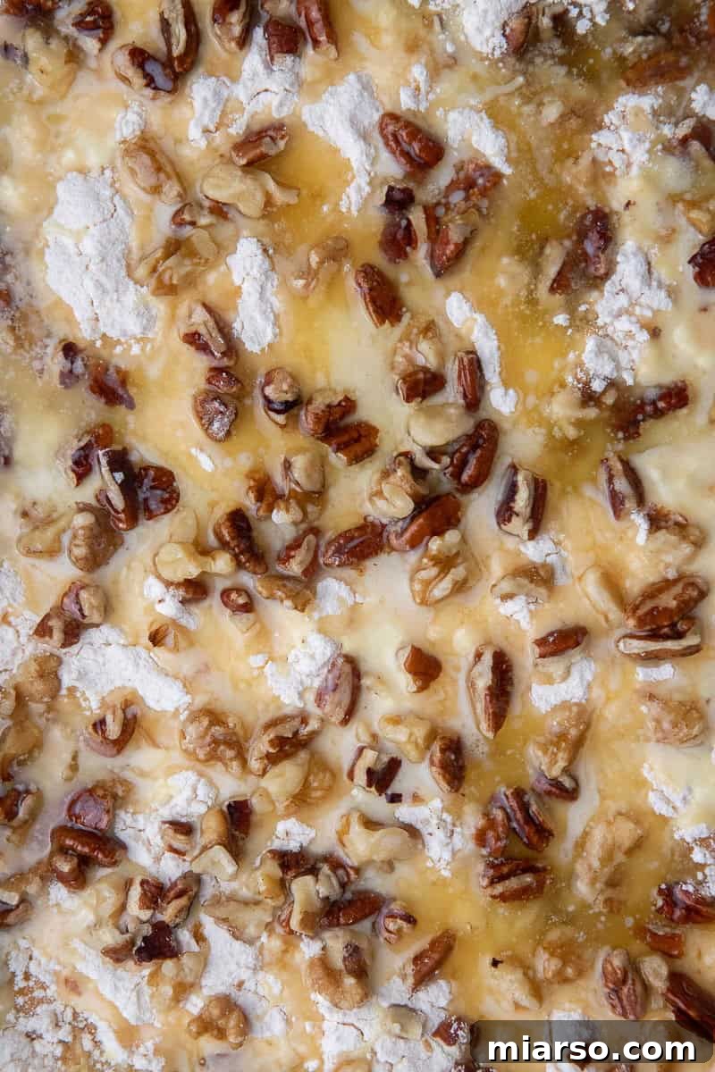 Cake mix and pecan layer with melted butter drizzled on top