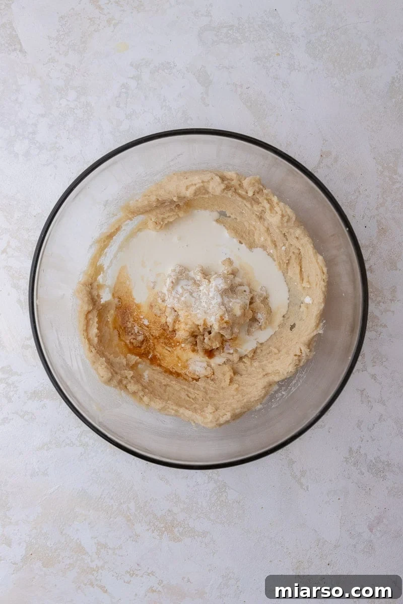 Wet ingredients in a mixing bowl for brownie batter
