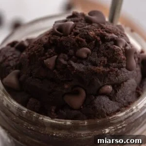 Scoop of edible brownie batter in a cup