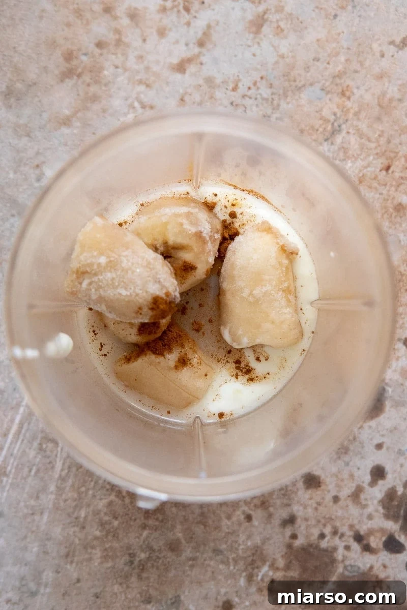 Frosty Peanut Butter Banana Pupsicles 5 All ingredients for dog treats in a blender