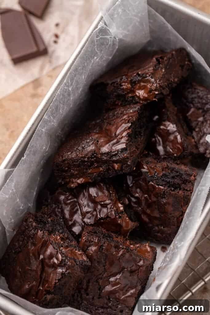 Chewy brownies cooling in a loaf pan