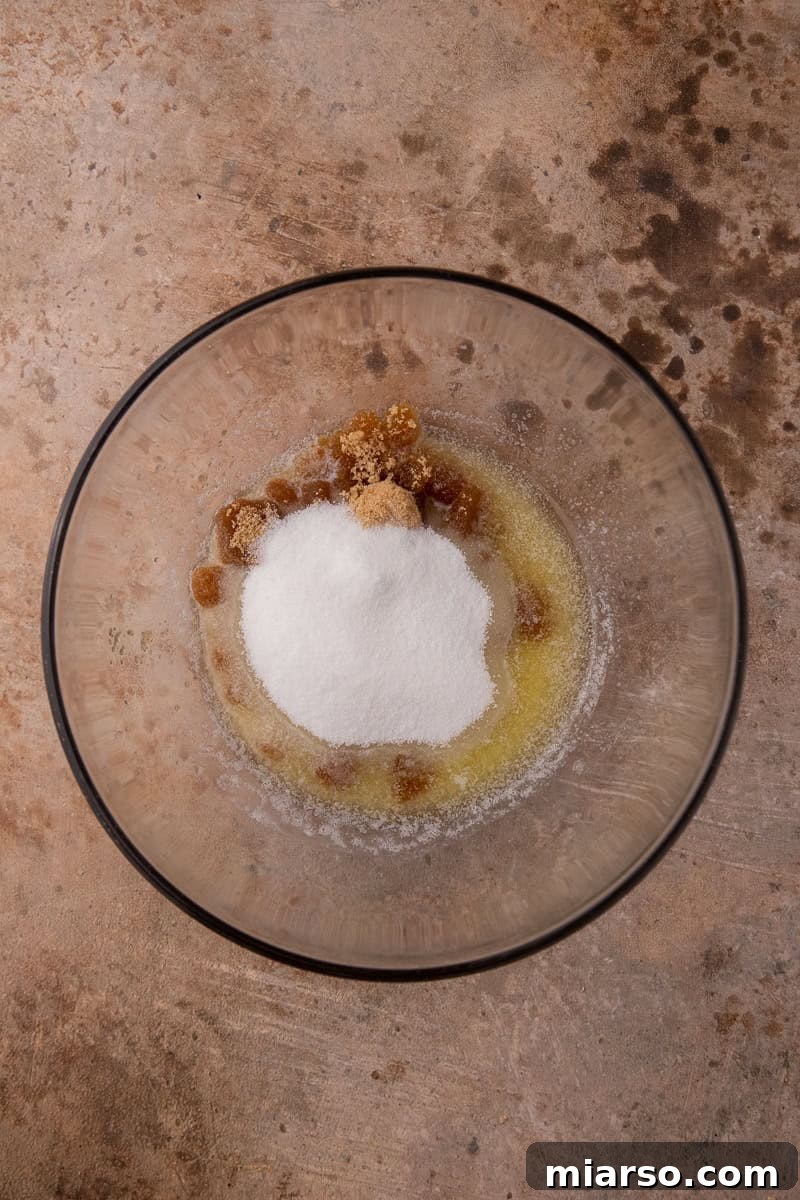 Wet ingredients being mixed in a bowl for brownies