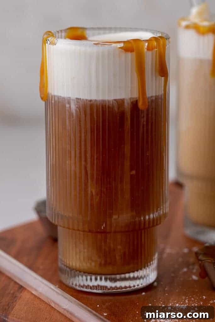 Close up of coffee marbeling with salted caramel cold foam