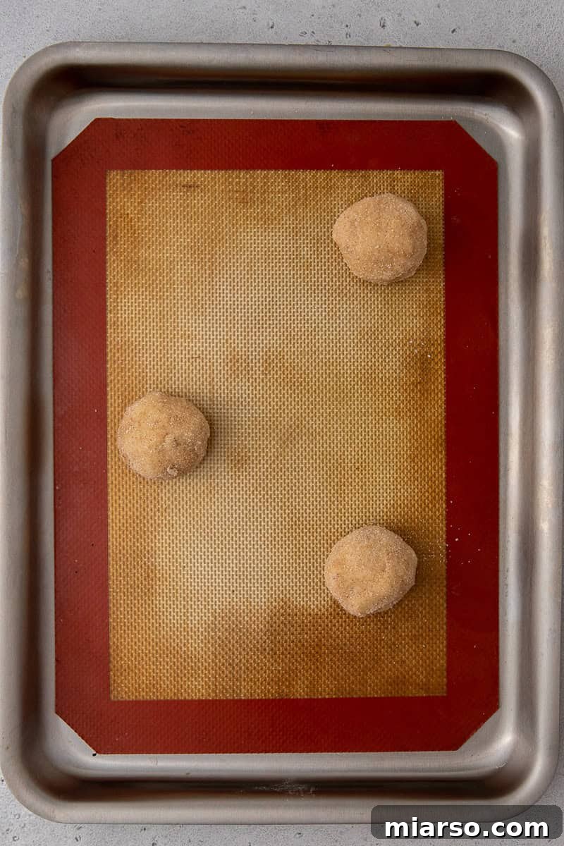 Cookie dough balls on a baking sheet