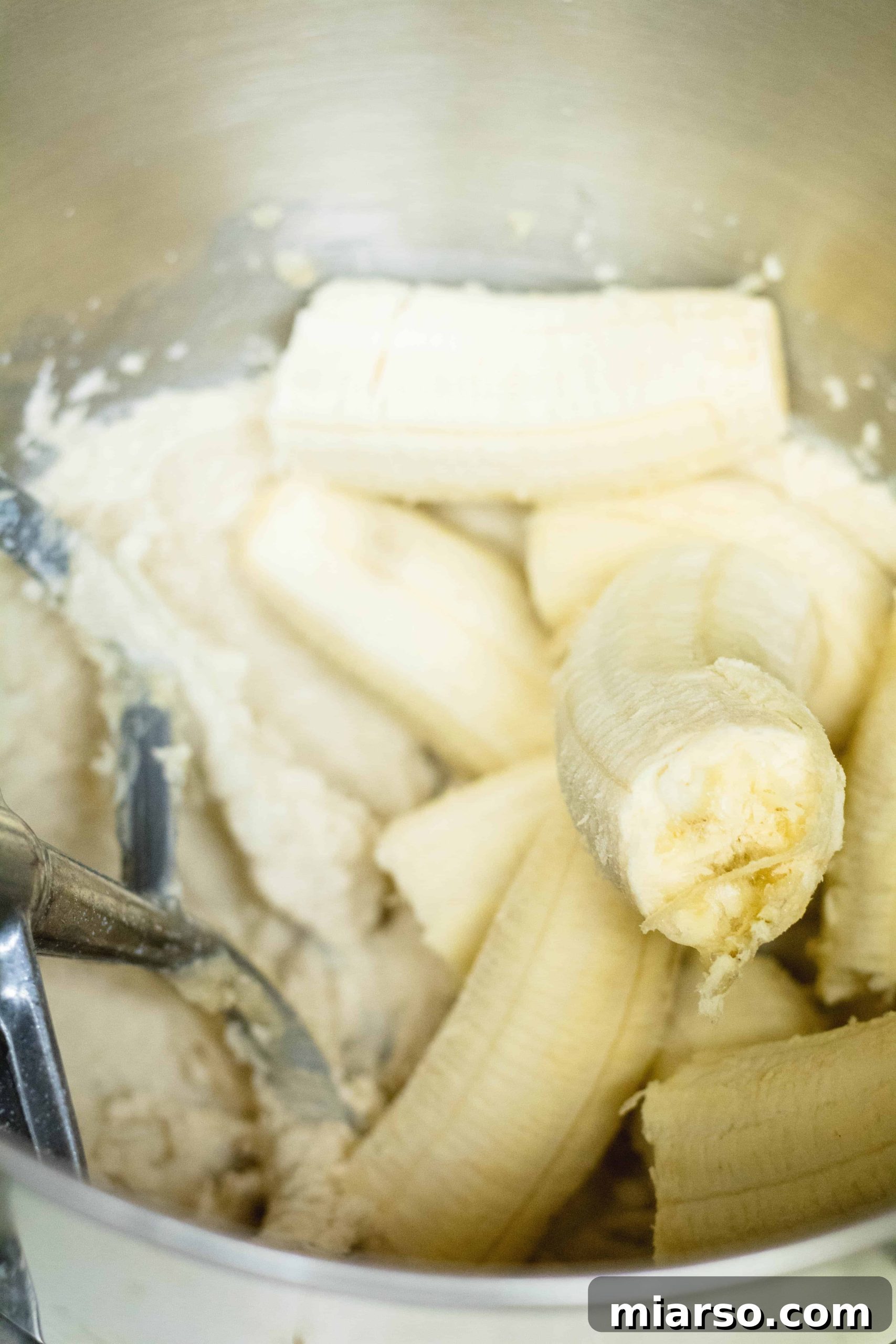 Bakery-Style Banana Walnut Muffins 11 Adding ripe bananas to the creamed butter and sugar mixture for muffin batter