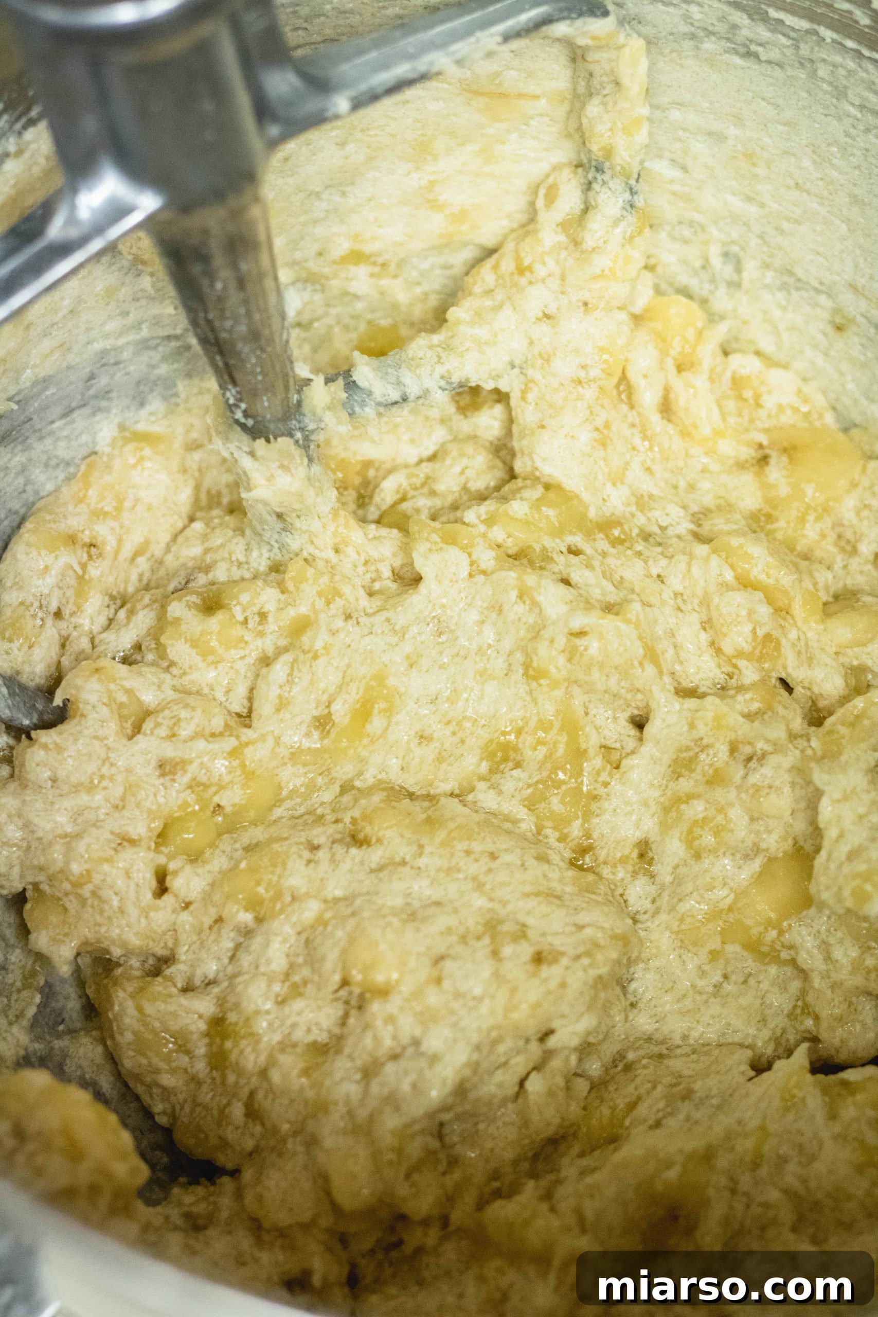 Bakery-Style Banana Walnut Muffins 12 The banana nut muffin batter mixture after adding bananas, showing a thick consistency