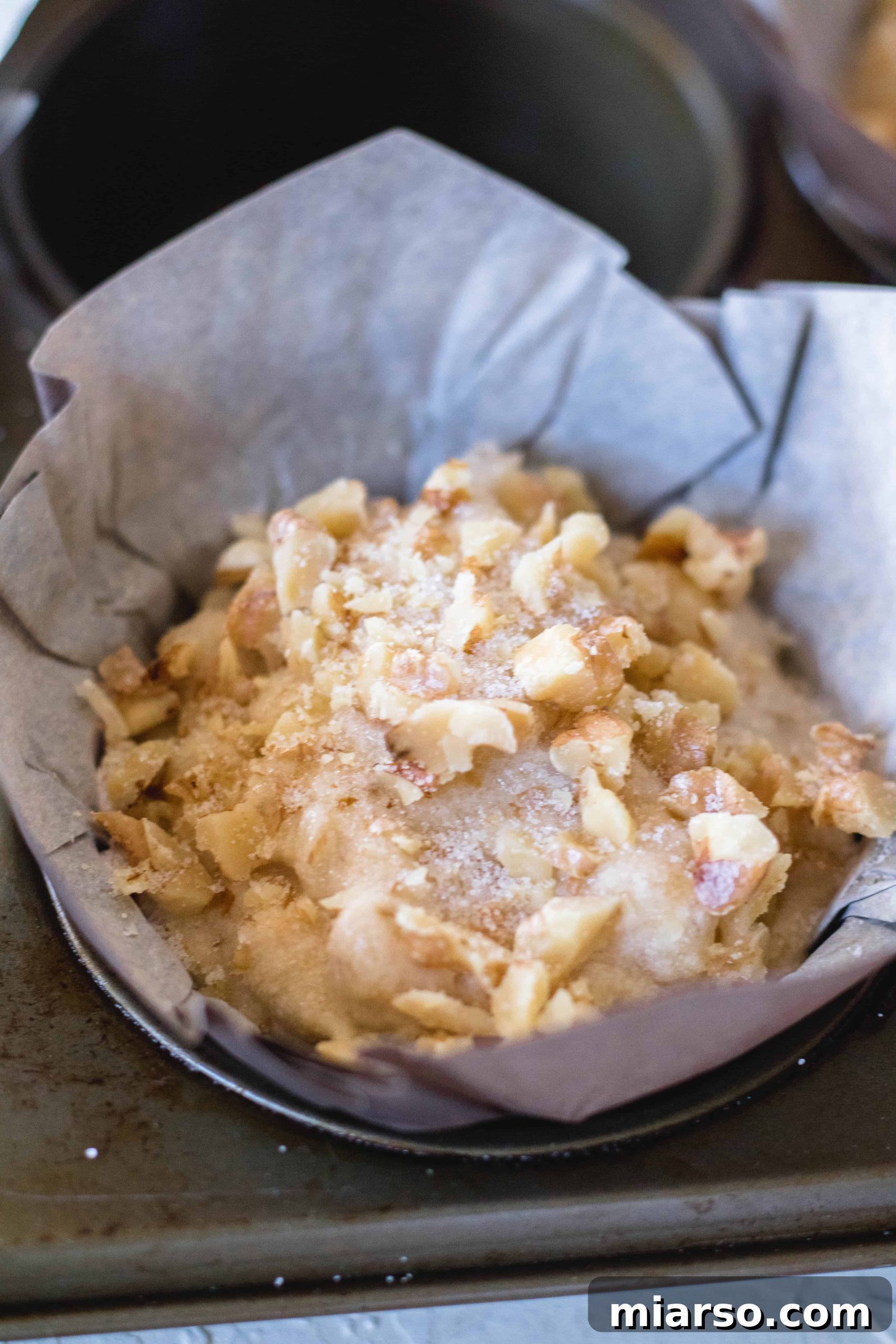 Bakery-Style Banana Walnut Muffins 18 Muffin tops sprinkled with additional walnuts and granulated sugar for extra crunch and sweetness