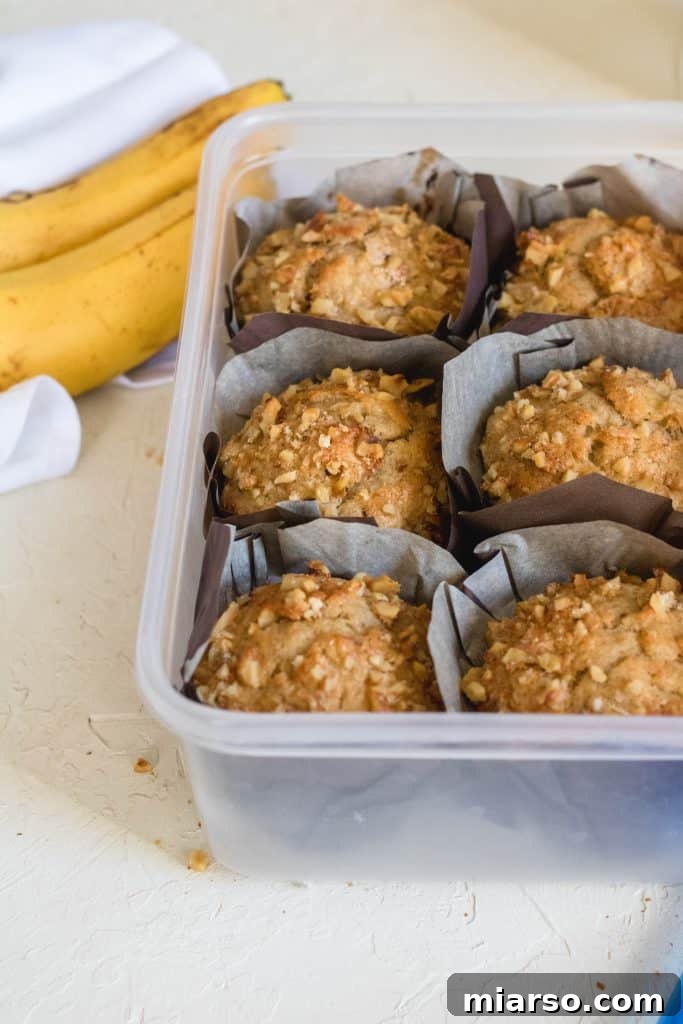 Bakery-Style Banana Walnut Muffins 21 Close-up of a banana walnut muffin, showing how to store them