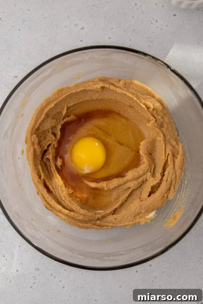 Ultimate Soft and Chewy Butterfinger Cookies 4 Egg added to creamed peanut butter and sugar mixture for Butterfinger cookies