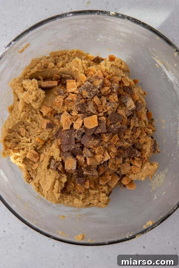 Ultimate Soft and Chewy Butterfinger Cookies 5 Butterfinger pieces mixed into cookie dough