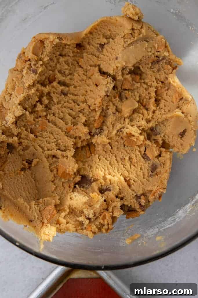 Ultimate Soft and Chewy Butterfinger Cookies 6 Close-up of Butterfinger peanut butter cookie dough texture