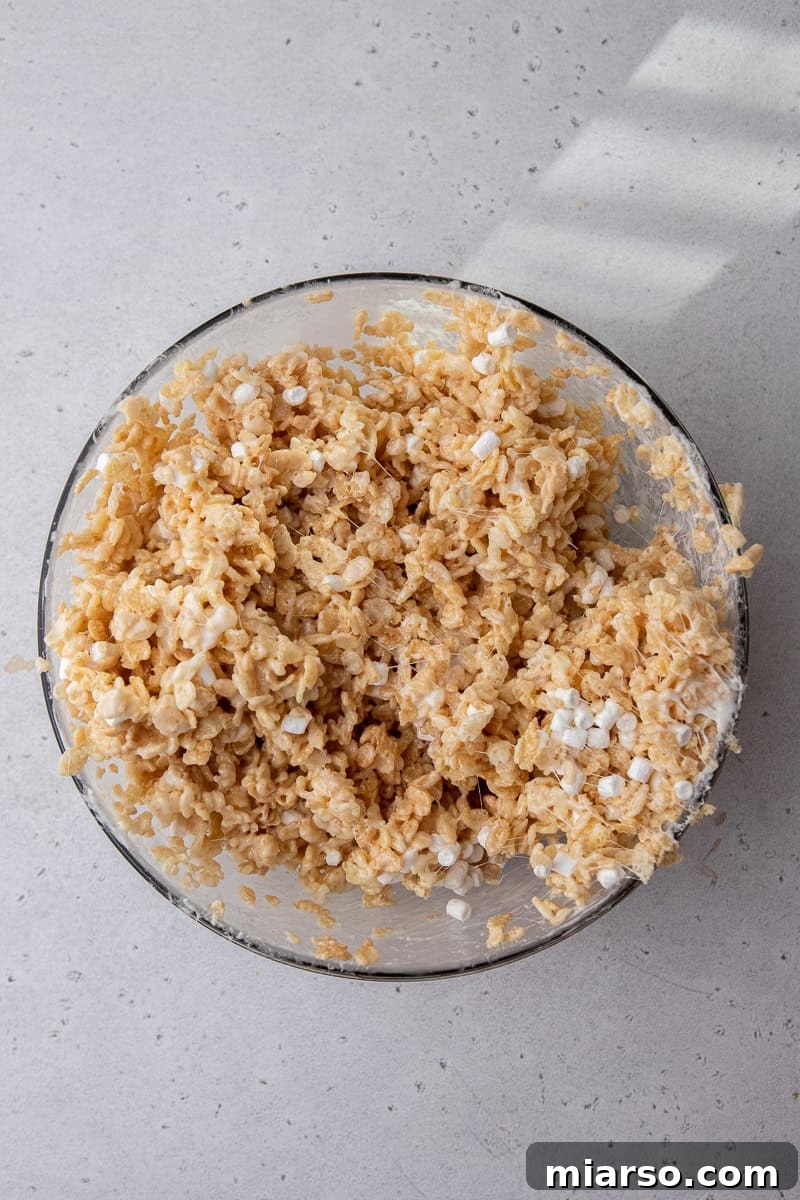 The fully combined Rice Krispies and marshmallow mixture, ready for shaping.