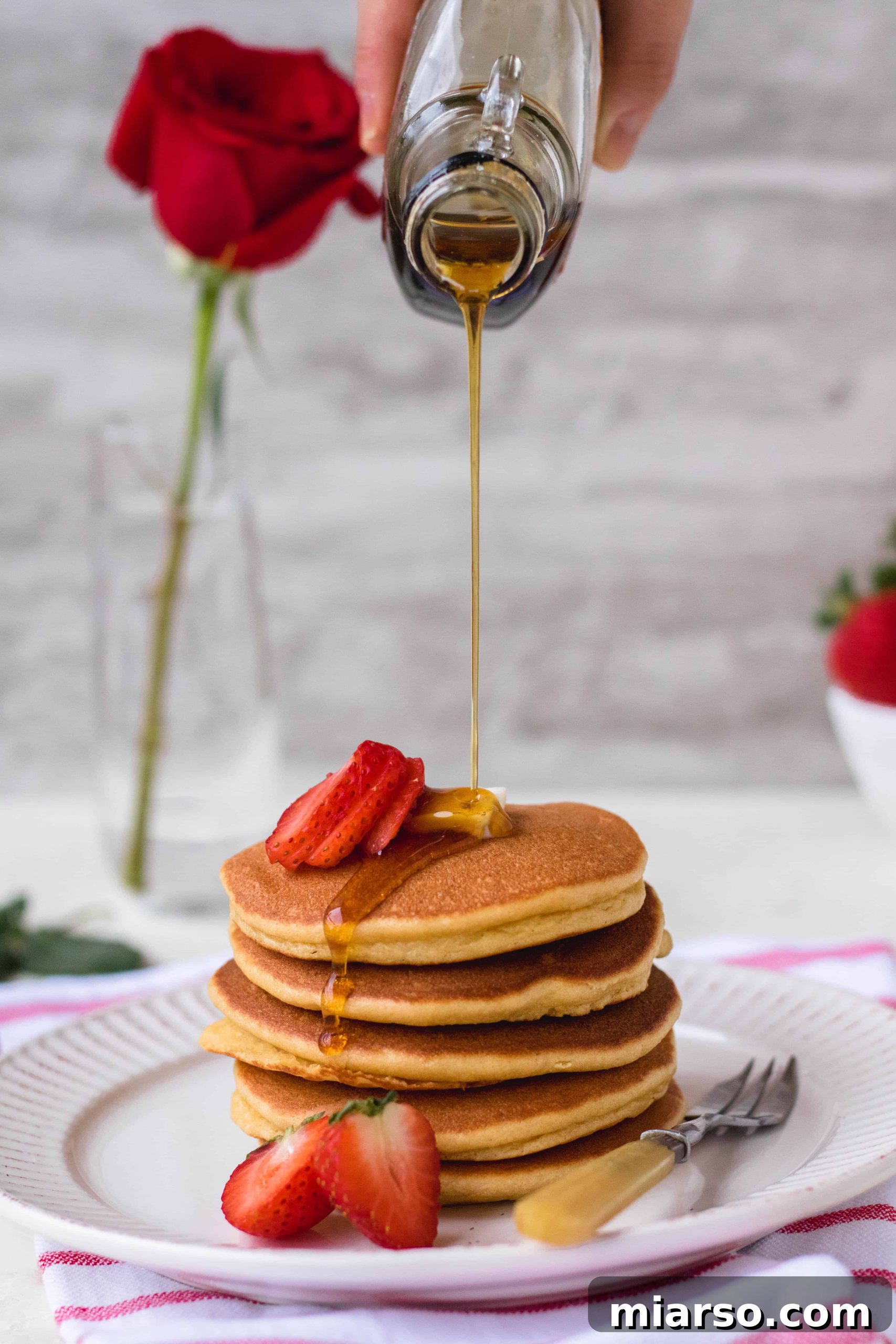 Ultimate Fluffy Almond Flour Pancakes 2 Stack of fluffy almond flour pancakes with berries and syrup