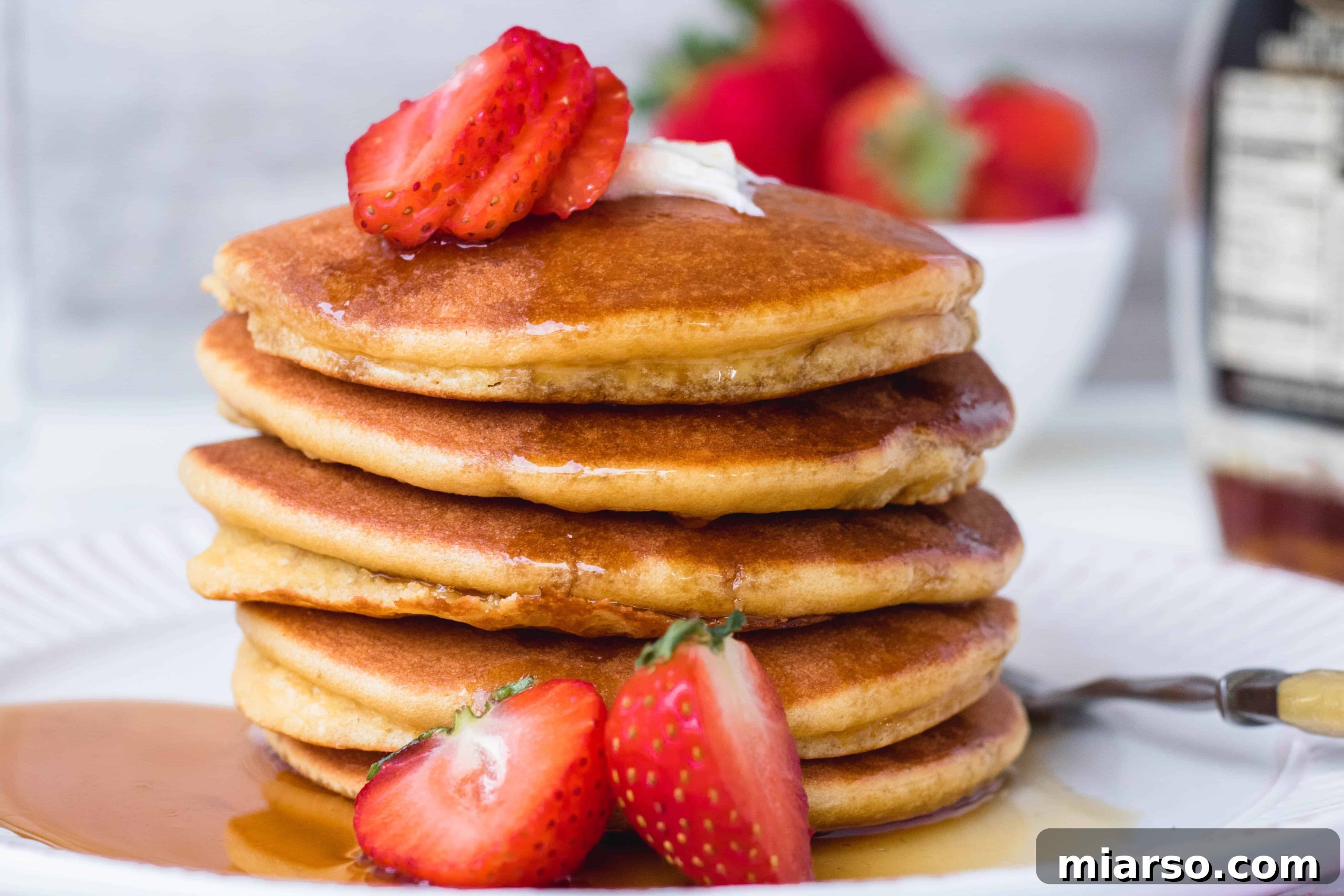 Ultimate Fluffy Almond Flour Pancakes 4 Three paleo almond flour pancakes stacked on a plate