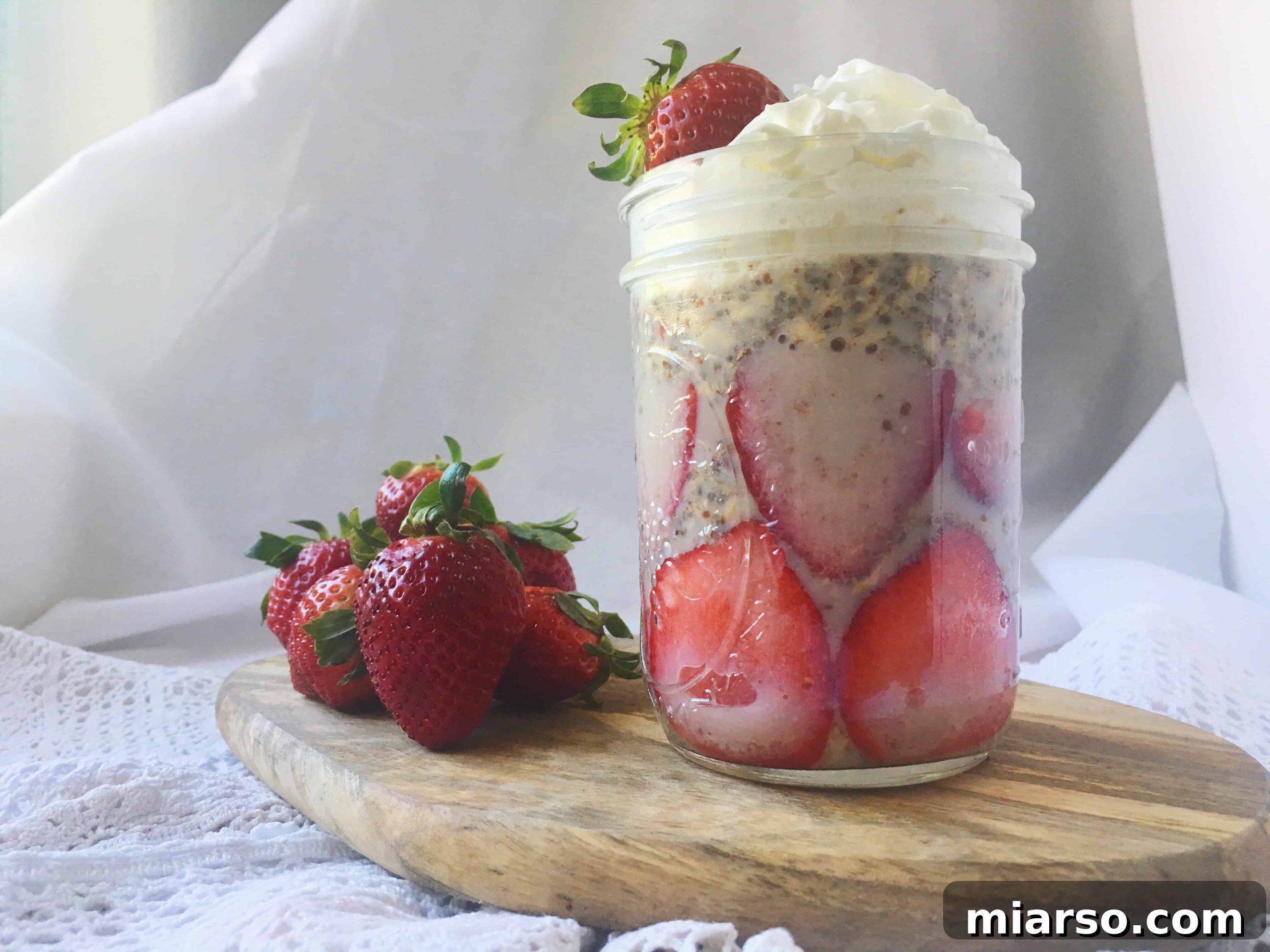 Dreamy Strawberry Overnight Oats 2 Delicious strawberries and cream overnight oats with chia seeds and flax seeds, ready to eat.