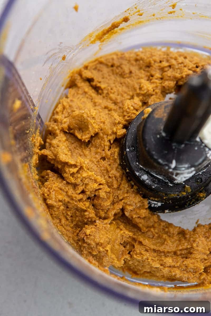 Divine Chocolate Pumpkin Truffle Delights 5 Mixing pumpkin truffle ingredients in a food processor