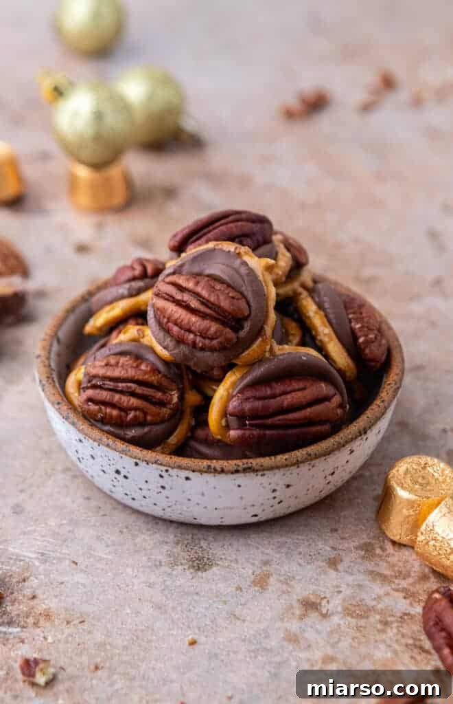 A stack of delicious Rolo Pretzel Turtles on a plate, ready to be enjoyed.