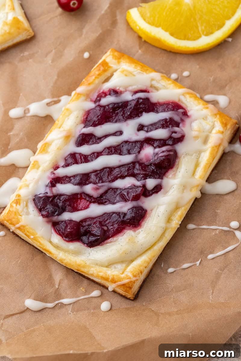 Cranberry Cheese Danish Revival 10 Unbaked cranberry cheese danishes brushed with egg wash, ready for the oven.