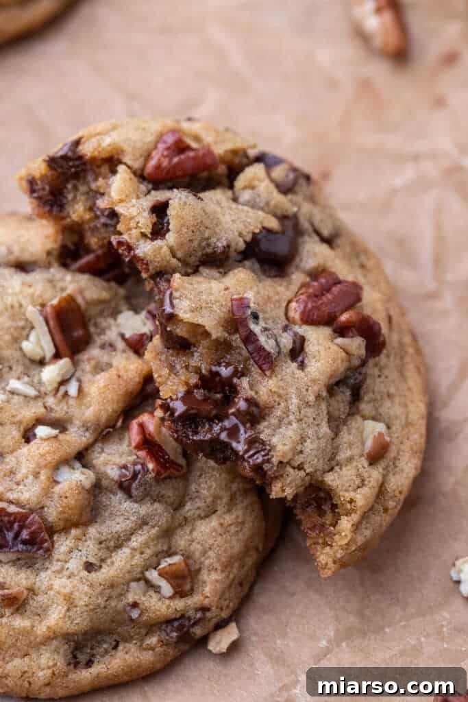 Pecan chocolate chip cookie broken in half