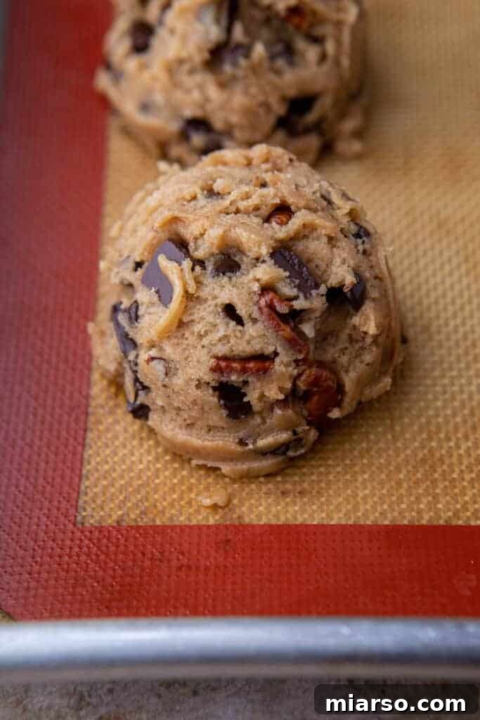 Cookie dough ball on tray ready to bake