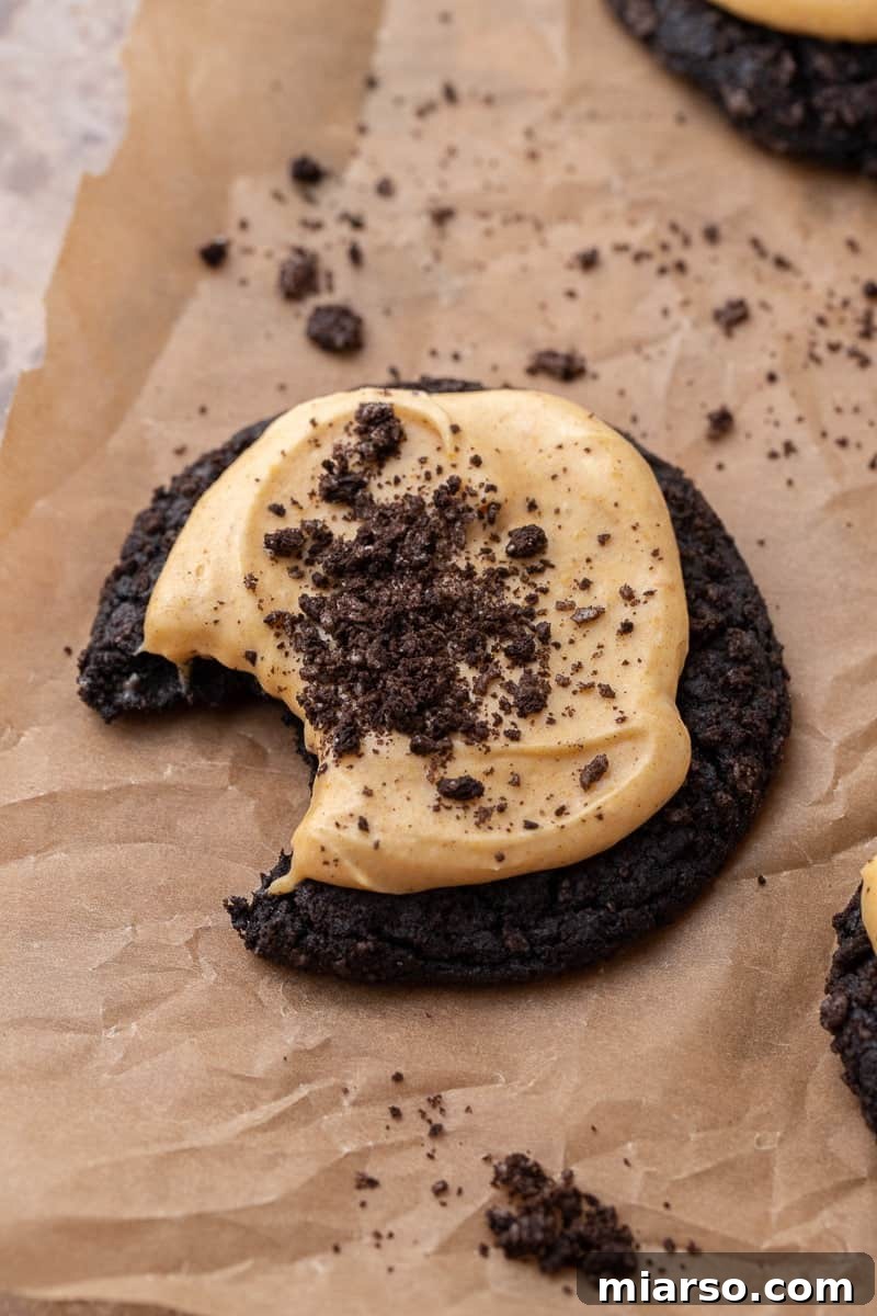 Decadent Crumbl Chocolate Pumpkin Cheesecake Cookies 12 Finished pumpkin cheesecake cookies, frosted and topped with Oreo crumbles