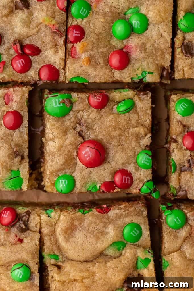 Irresistible Holiday M&M's Blondies 2 Close up of festive Christmas blondies adorned with red and green M&M's
