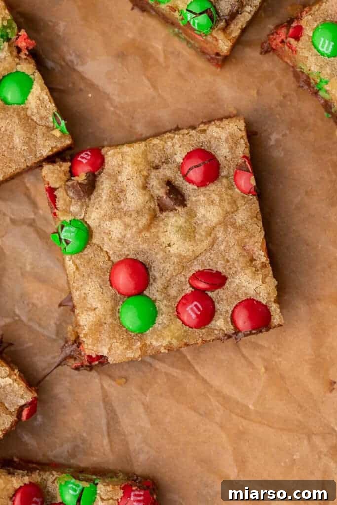 Irresistible Holiday M&M's Blondies 11 A single M&M Christmas blondie, showing its appealing texture and toppings