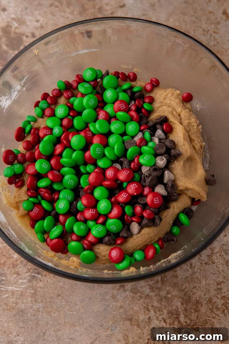Irresistible Holiday M&M's Blondies 6 Blondie cookie dough being mixed in a bowl, showing initial texture