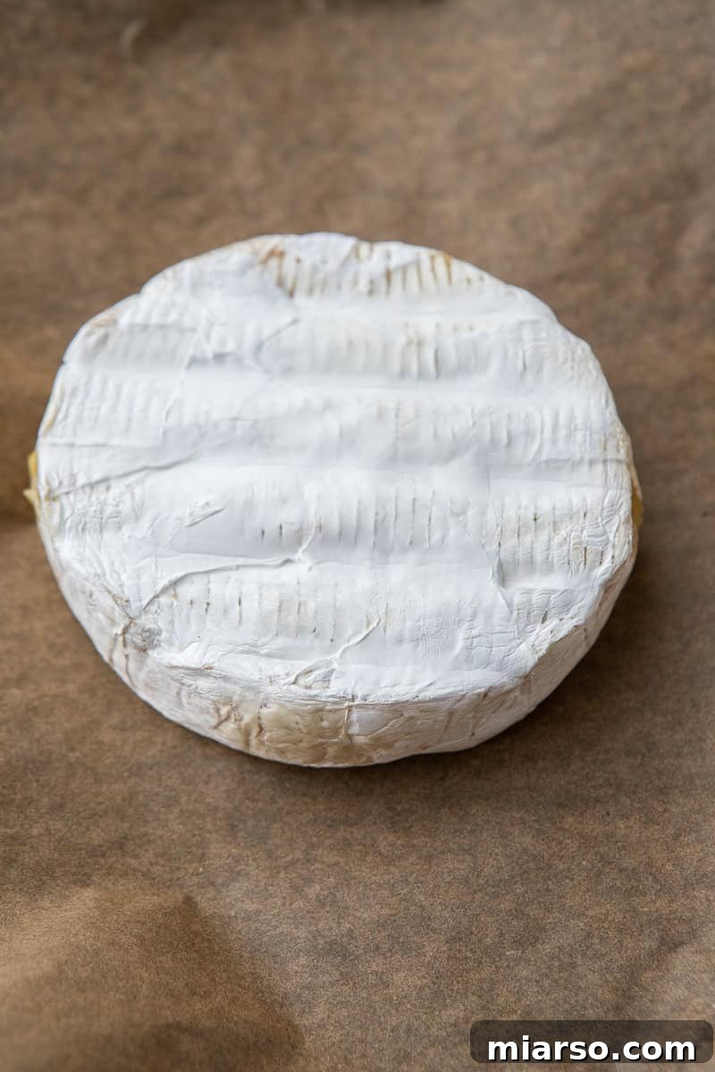 Unwrapped Brie Cheese Ready for Baking
